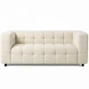 Canapé double capitonné en tissu bouclette beige