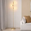 Lampadaire sur pied en métal doré avec 3 abat-jours globe verre