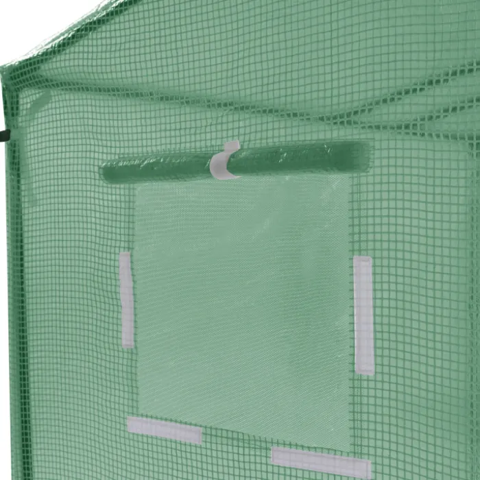 Serre de jardin verte avec porte et fenêtres relevables